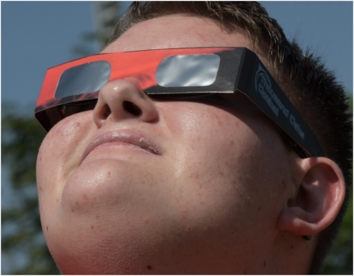 Photo of Matt looking towards the sun during an eclipse